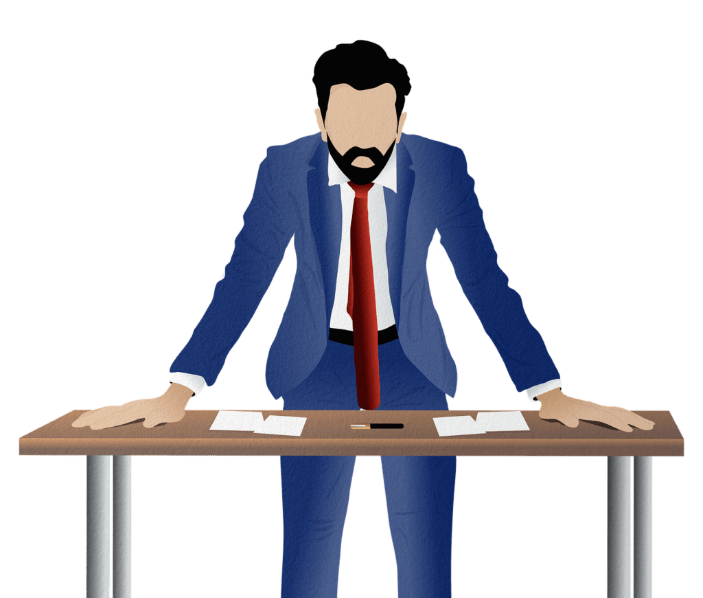 cartoon image of business man leaning on table with paperwork